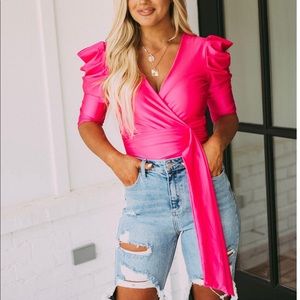 Fuchsia bodysuit with statement puffy sleeves